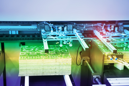 Automation of machine assembly of circuit board with robot arm,Smart factory industry 4.0 concept.