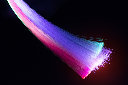Fiber optics network cable lights abstract backgroundの写真素材