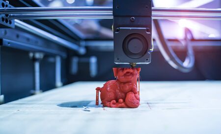 3D printer printing pig figure close-up.の写真素材