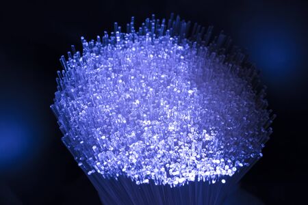 fiber optics network cable for ultra fast internet communications, thin light threads that move information at high speed.の写真素材