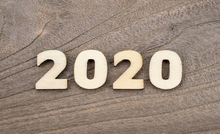 Happy New Year 2020 concept, Wood block 2020 on wooden background