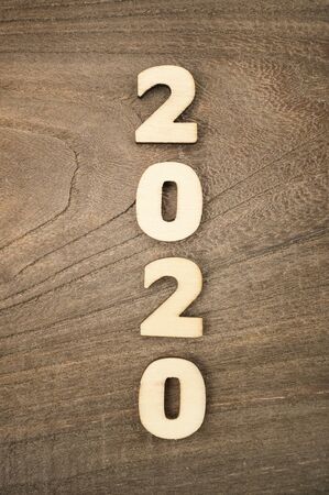 Happy New Year 2020 concept, Wood block 2020 on wooden backgroundの写真素材