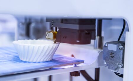 3D printer or additive manufacturing and robotic automation technology.