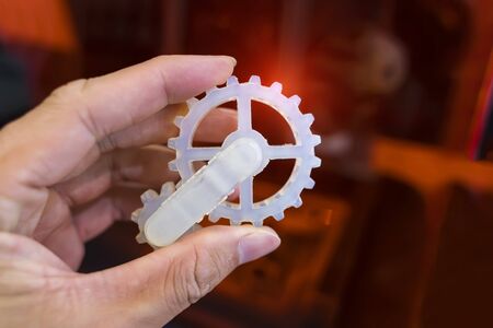 hand with Object printed on 3d printer close-up