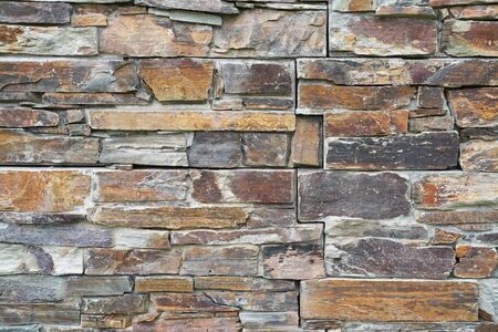 Stone wall composed of stones of various shapes,Natural background