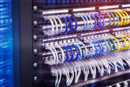 network cable connecting on network core switch close up