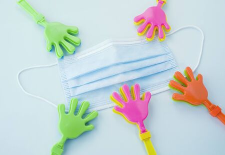 hand clap toy plastic toy hands for Respiratory protection mask,Health care and medical concept.