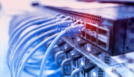 network cable connecting on network core switch close upの写真素材