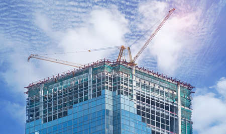 Construction work site on blue sky background