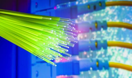 Fiber optics network cable on technology background