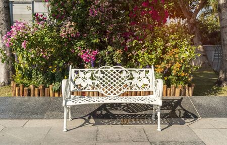 White Metal Bench in the Gardenの写真素材