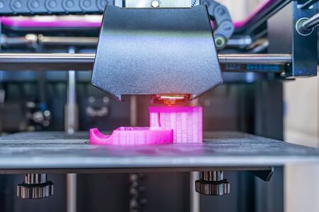 3D printer or additive manufacturing and robotic automation technology.