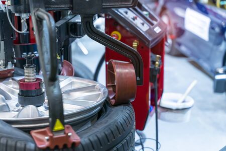 Tire changer machine in a car service centerの写真素材