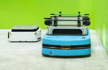 warehouse robot car carries cardboard box assembly in factory