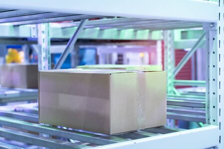 boxes in the cells of the automated warehouse. Metal construction warehouse shelvingの写真素材