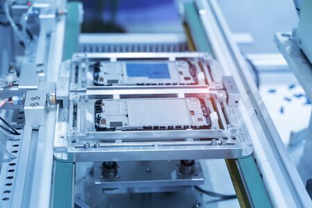 intelligence machine working in mobile phone factory,Smart factory industry 4.0 concept.