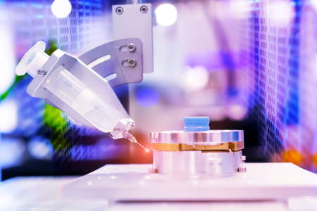 automatic holding glue syringe Injection in factoryの写真素材