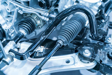 Elements of modern car front suspension. Control arm. Tie rod. Drive unit. Wheel bearing housing.
