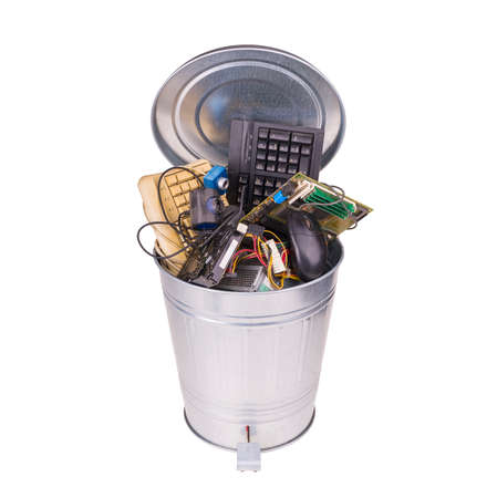 different computer parts in trash canの写真素材