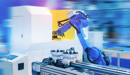 robot gripping and smart robot working on smart factory,industry 4.0 and technology.