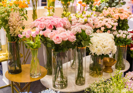 pink and white flowers in a glass vase in wedding dayの写真素材