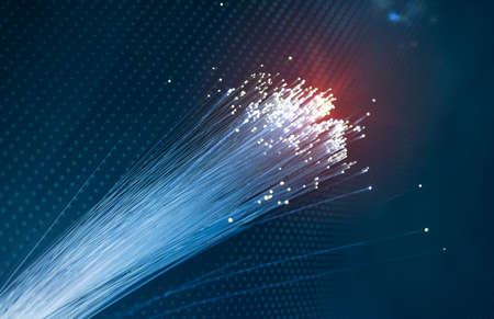 colorful optical fibres dinamic flying from deep on technology backgroundの写真素材