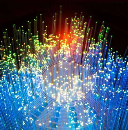 Fiber optics network cable on technology background