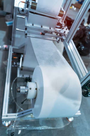 non woven material on automatic machine for the manufacture of medical masks with nanofiber....
