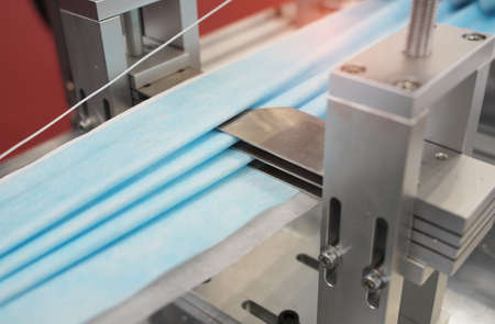 non woven material on automatic machine for the manufacture of medical masks with nanofiber.