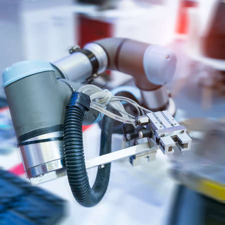 automatic arm catch for electronic assembly line. The robot for smart technology manufacturing...