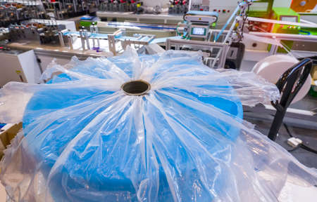 medical mask production line use of polypropylene as raw materials to manufacture melt blown cloth.の写真素材