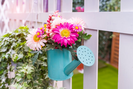 Hanging Flower Pots with fenceの写真素材