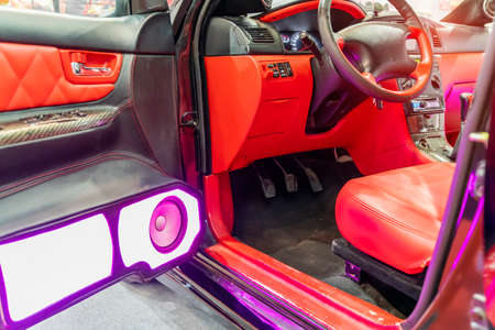 colorful lights of stereo and speakers in carの写真素材