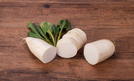 Daikon radish on the wood backgroundの写真素材