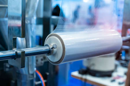 Laminating and rewinding kind of protective film machine with clamping rollers automatic edge bandingの写真素材