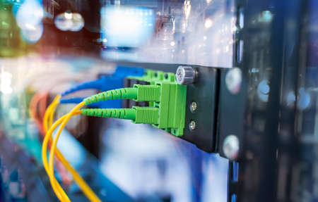 green optical patch cords inserted into the green optical ports, professional external device for...