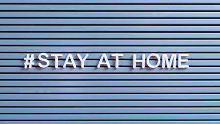 "STAY AT HOME" staying home self-quarantine text message sign for social distancing awareness.の写真素材
