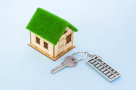 key chain in shape of abacus with model of houseの写真素材
