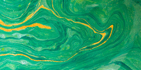 Abstract poster green watercolor background drawn by brush. Gold shiny splashes lines. Elegant...