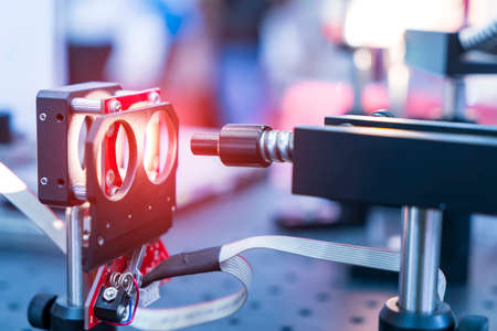 Experiment with laser device in optical laboratoryの写真素材