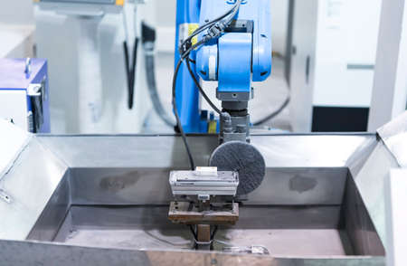 robot arm polishing the mobile phone part in the production line.の写真素材