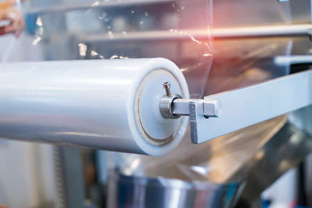 Laminating and rewinding kind of protective film machine with clamping rollers automatic edge bandingの写真素材