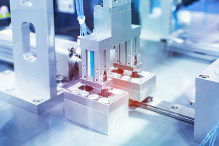 robotic pneumatic piston sucker unit on industrial machine,automation compressed air factory...