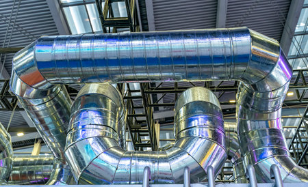 Industrial steel pipes or tubes of air ventilation system as abstract industry equipment background