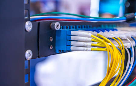 Fiber Optic cables connected to an optic portsの写真素材