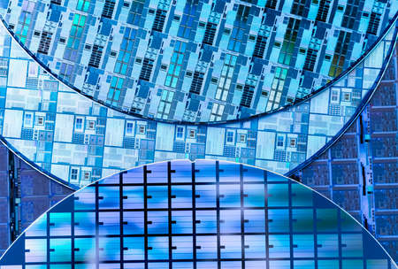 Silicon Wafers with microchips used in electronics for the fabrication of integrated circuits
