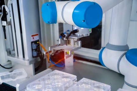 robotic arm catch for electronic assembly line. The robot for smart technology manufacturing process.の写真素材