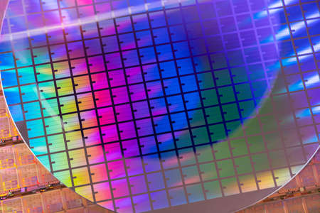 Silicon Wafers with microchips used in electronics for the fabrication of integrated circuitsの写真素材