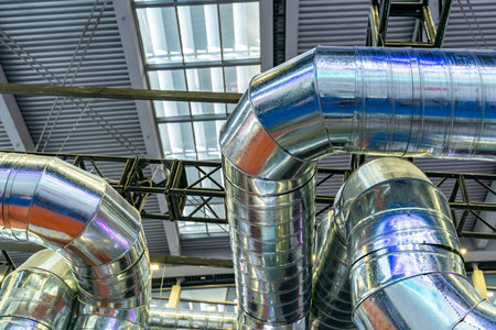 Industrial steel pipes or tubes of air ventilation system as abstract industry equipment backgroundのeditorial素材