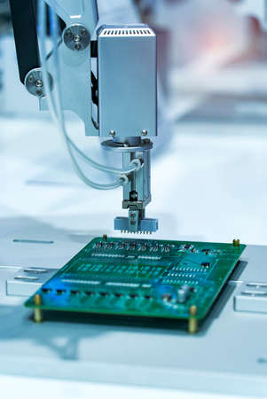 automatic robot for print circuit board (PCB)assembly machine during soldering or welding part at...